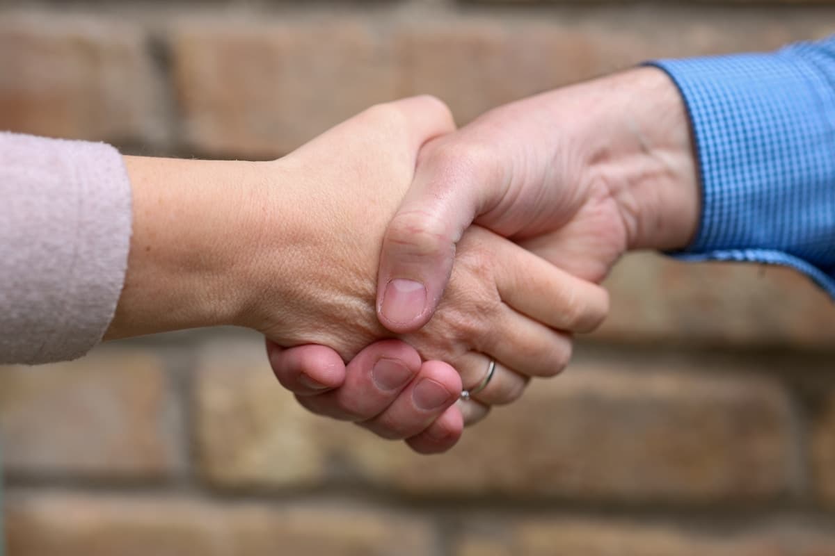Two business leaders shaking hands after a partnership agreement